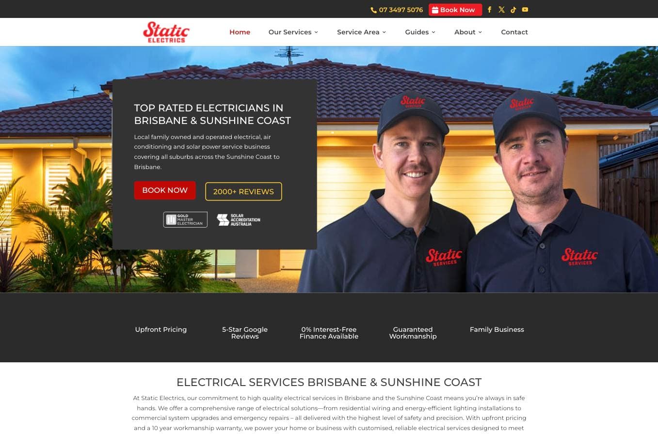 Static Electrics homepage — real editorial photography of two technicians in branded uniforms outside a house at dusk, with a "2000+ REVIEWS" badge