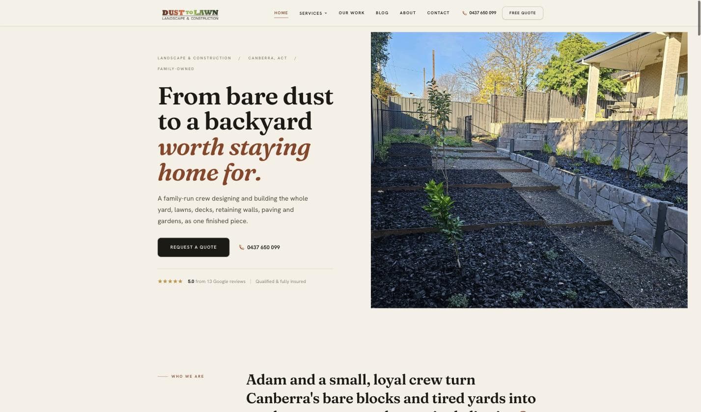 Dust to Lawn homepage — a newly landscaped Canberra backyard with dark mulch, timber-edged garden beds and young trees under a blue sky